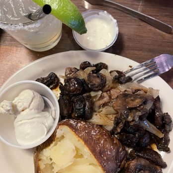 Texas Roadhouse - Smothered sirloin steak with a baked potato - Salad Near Me - Henderson, Nevada