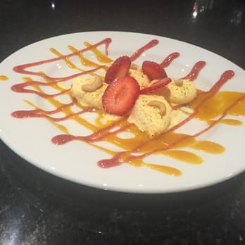 Saffron - strawberries and ice cream on a white plate - Indian Near Me - Cambridge, Ontario Saffron - strawberries and ice cream on a white plate - Indian Near Me - Cambridge, Ontario