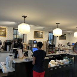 a woman standing at the counter