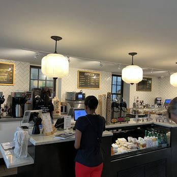 Balzac's Coffee Roasters - a woman standing at the counter - Coffee & Tea Near Me - Vaughan, Ontario