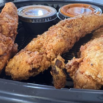 Ghosted Concepts - Chicken Tenders - 2 regular (right) and one Nashville style (left) - Caterers Near Me - Haymarket, Virginia