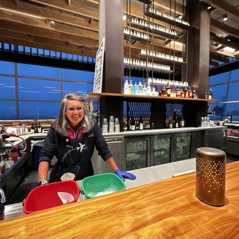 Alaska Lounge - North Satellite - Miss Rhonda at the bar. - Airport Lounges Near Me - Seattle, Washington
