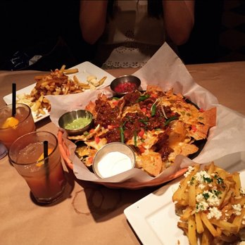 Jack's Astor's - Ye Olde Faithful Macho Nacos with Beef Chili (middle) and Classic Stack'd Poutine (top and bottom) - Canadian (New) Near Me - Scarborough, Ontario Jack's Astor's - Ye Olde Faithful Macho Nacos with Beef Chili (middle) and Classic Stack'd Poutine (top and bottom) - Canadian (New) Near Me - Scarborough, Ontario