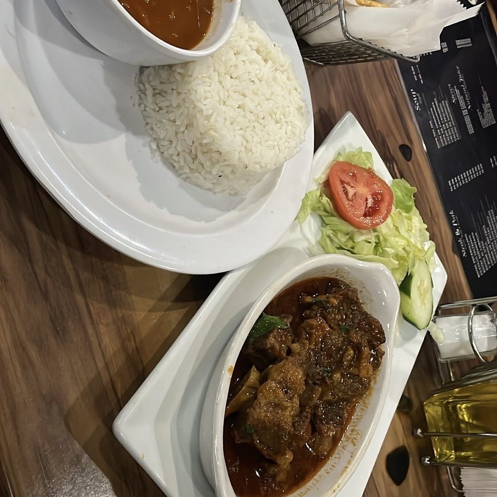 Oxtail w/ Red Rice & Beans Oxtail w/ Red Rice & Beans