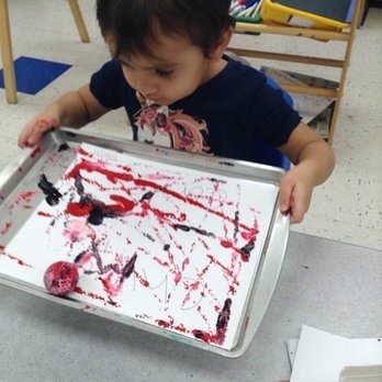 The Goddard School of Allen - East - A picture that was sent in her report to show that she was painting with a golf ball! - Preschools Near Me - Allen, Texas The Goddard School of Allen - East - A picture that was sent in her report to show that she was painting with a golf ball! - Preschools Near Me - Allen, Texas