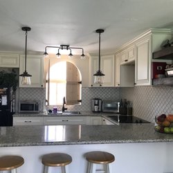 MyCabinetParts - Here is the after photo of the kitchen featuring the cabinets, the handles, and the gray granite we purchased from this company.