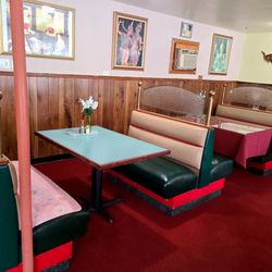 Indoor seating has comfortable booth available