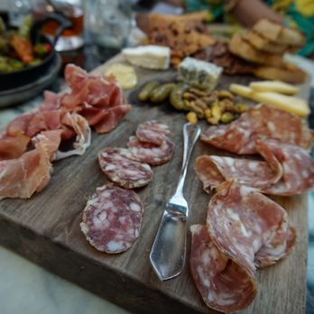 Eberly - Charcuterie board ($26) - Antonelli's cheese selection, cured meats, seasonal accoutrements, crackers - Bars Near Me - Austin, Texas Eberly - Charcuterie board ($26) - Antonelli's cheese selection, cured meats, seasonal accoutrements, crackers - Bars Near Me - Austin, Texas