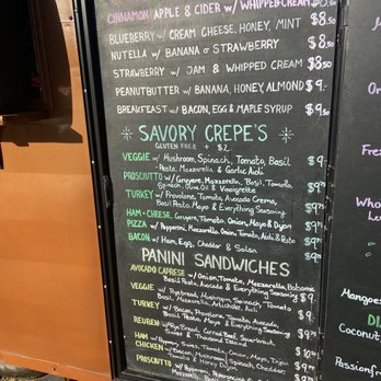 The Rye Bread Bar - The image shows a black chalkboard menu for a food truck, divided into sections for sweet crepes, savory crepes, and sandwiches. The sweet crepes include options like cinnamon apple, blueberry, Nutella with banana or strawberry, and peanut butter with banana or honey. The savory crepes feature veggie, prosciutto, turkey, ham & cheese, pizza, and bacon options, with ingredients and prices. The sandwiches section lists panini options such as avocado caprese, veggie, turkey, reuben, ham, chicken, and prosciutto, with detailed ingredients and prices. The menu is handwritten in colorful chalk, with some decorative elements, and the food truck is temporarily closed. - Food Trucks Near Me - Austin, Texas
