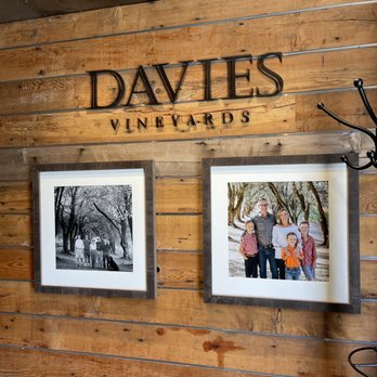 Davies Vineyards - a couple of framed photos hanging on a wall - Wine Tasting Room Near Me - Saint Helena, California