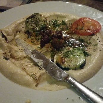 Petra Bistro - I forgot to take a picture before I started eating... one of the best hummus plates I've ever had. - Mediterranean Near Me - Seattle, Washington