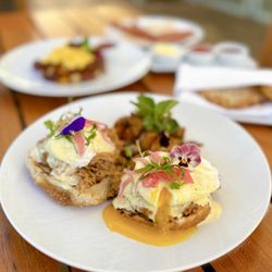 Forum At Meadowood - Cochinita Pibil Benedict: Yucatán braised pork, pickled onions, charred jalapeño hollandaise, model bakery english muffin, potatoes ($32)