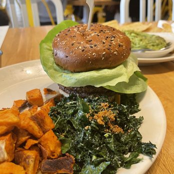 True Food Kitchen - Vegan cheeseburger, side of kale and sweet potatoes. - New American Near Me - Chicago, Illinois True Food Kitchen - Vegan cheeseburger, side of kale and sweet potatoes. - New American Near Me - Chicago, Illinois