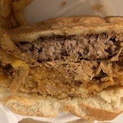 Norma Jean's Bar & Grill Room - This is half of my Cowboy Burger, I asked for the barbecue sauce on the side that's why you don't see it. But that is not medium rare.