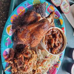 Pulled pork, chicken, ribs, slaw, and beans Pulled pork, chicken, ribs, slaw, and beans