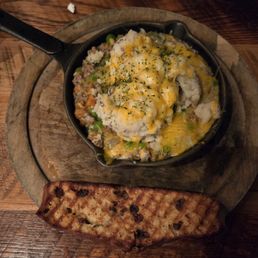 Shepherd's pie. Served in a hot skillet with a side of grilled Irish bread. Shepherd's pie. Served in a hot skillet with a side of grilled Irish bread.