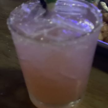 All American Sports Bar - a purple drink with a lime garnish - Sports Bars Near Me - Springfield, Massachusetts All American Sports Bar - a purple drink with a lime garnish - Sports Bars Near Me - Springfield, Massachusetts