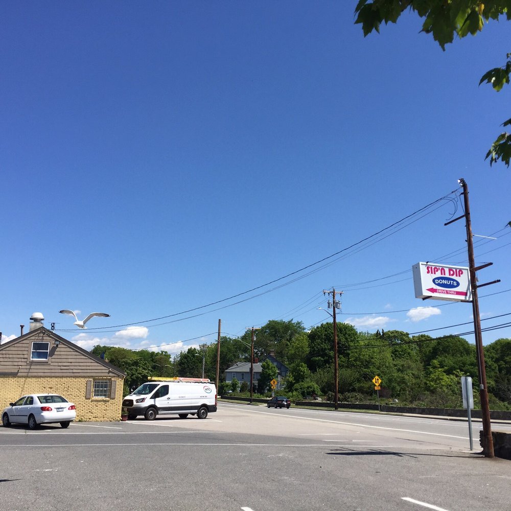 Sip N' Dip Donuts - Exterior and parking lot - Donuts Near Me - Bristol, Rhode Island Sip N' Dip Donuts - Exterior and parking lot - Donuts Near Me - Bristol, Rhode Island