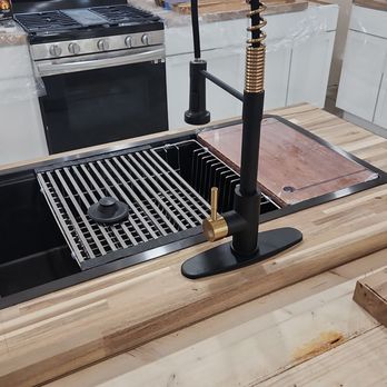 DP Contracting - a kitchen sink with a black faucet - General Contractors Near Me - Leander, Texas