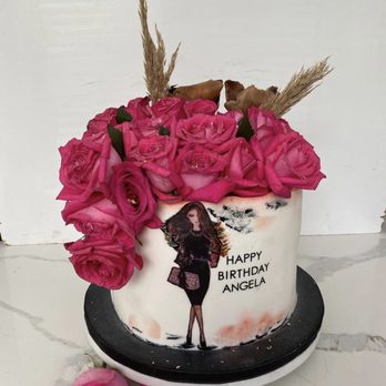 Ellya's Cake Boutique - a woman holding a bouquet of pink roses - Cupcakes Near Me Ellya's Cake Boutique - a woman holding a bouquet of pink roses - Cupcakes Near Me