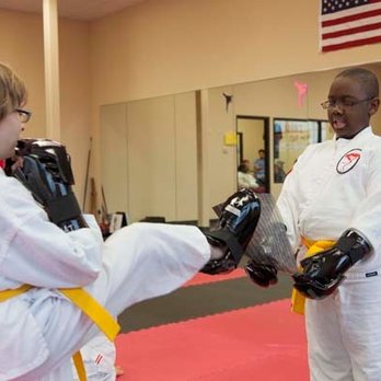 Dojo Karate - Rogers - Children training hard at our eight locations throughout Minnesota: Maple Grove, Elk River, Monticello, Buffalo, Waconia, Rog... - Karate Near Me - Rogers, Minnesota