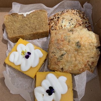 Front Porch Baking - Top left going clockwise: Olive Oil cake, everything scone, cheddar scone and two lemon bars. - Bakeries Near Me - Lancaster, Pennsylvania Front Porch Baking - Top left going clockwise: Olive Oil cake, everything scone, cheddar scone and two lemon bars. - Bakeries Near Me - Lancaster, Pennsylvania