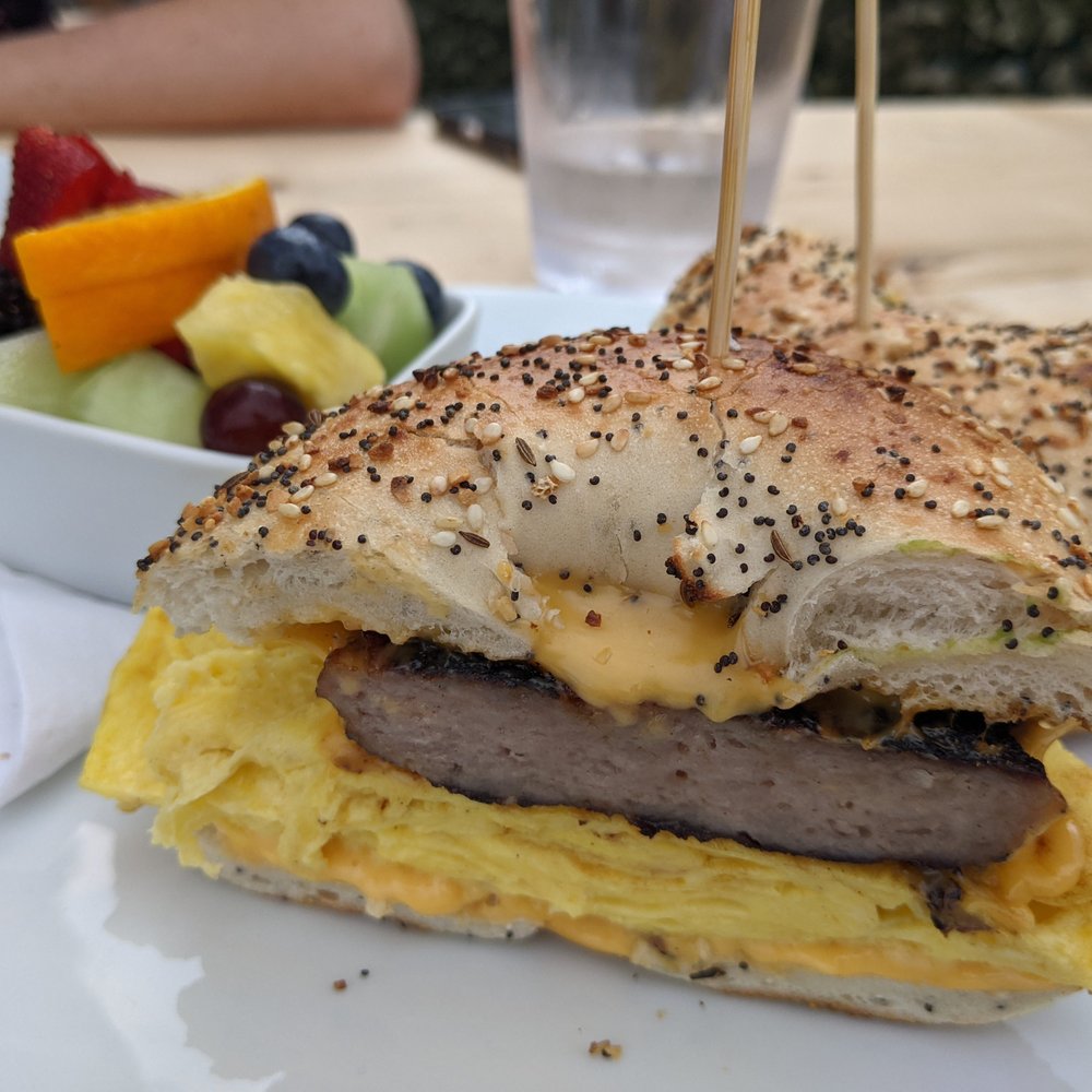 The Hen - Bagel sandwich with a side of fruit (not included) - Breakfast & Brunch Near Me - Ann Arbor, Michigan The Hen - Bagel sandwich with a side of fruit (not included) - Breakfast & Brunch Near Me - Ann Arbor, Michigan