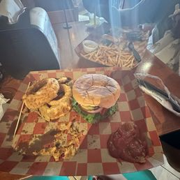 Burger and onion rings and burger and fries. Burger and onion rings and burger and fries.