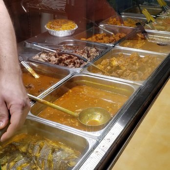 Rice and Beans Diner - a man preparing food - Spanish Near Me - Harrisburg, Pennsylvania