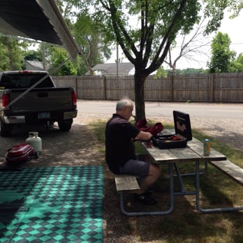 Holiday Park Campground - The highway is on the other side of the fence. Lot #149 - Campgrounds Near Me - Traverse City, Michigan