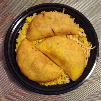 ArePA George - Empanadas with shredded chicken and beef sausage mixed with yellow rice, creole sauce, peas, and carrots. - Colombian Near Me - Chicago, Illinois ArePA George - Empanadas with shredded chicken and beef sausage mixed with yellow rice, creole sauce, peas, and carrots. - Colombian Near Me - Chicago, Illinois
