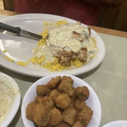 This is The Spinach Chicken with the sauce on it, as it comes . And you choose your sides . The side is Fried  Okra .