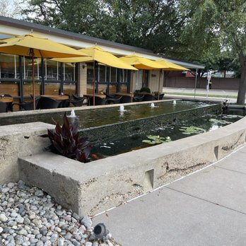 R+D Kitchen - Outside patio with koi pond - New American Near Me - Dallas, Texas
