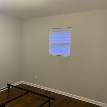 Platinum Painting and Contracting - a bedroom with a bed frame - Painters Near Me Platinum Painting and Contracting - a bedroom with a bed frame - Painters Near Me