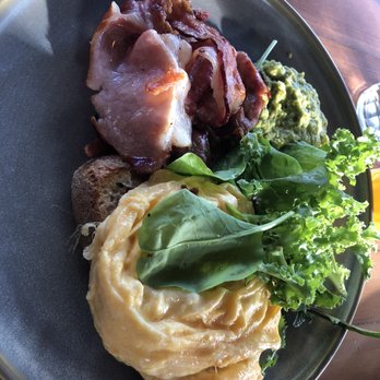 Three Blue Ducks, Byron Bay - Scrambled eggs with bacon and avo hummus - Cafes Near Me - Byron Bay, NSW Three Blue Ducks, Byron Bay - Scrambled eggs with bacon and avo hummus - Cafes Near Me - Byron Bay, NSW