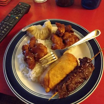 Dragon Dynasty - 1/4 of the General Tso Chicken dinner special with white rice and egg roll. Fried pot sticker appetizer and beef teriyaki appetizer - Chinese Near Me - Worcester, Massachusetts