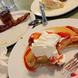 Country Waffles - Strawberry pancakes breakfast special combo with 2 bacon, 2 eggs ($10.99) with side of cinnamon roll ($5)!