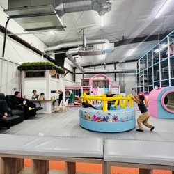 Playland Indoor Playground - In the back is a little closed off area for toddlers three years and younger, reclining seats on the left, a little miniature cafe.