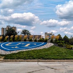 The University of Toledo - This is the university seal inside a traffic circle at one of its entries and, per the sky, that was a humid day (no review)