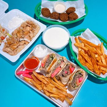 Iraklis - Clockwise: Falafel (5 pc - $2.99), Fries ($3.99), Lamb Wrap ($13.99), Chicken Shawarma Plate ($12.99), Labaneh ($6.99) - Syrian Near Me - Santa Clara, California Iraklis - Clockwise: Falafel (5 pc - $2.99), Fries ($3.99), Lamb Wrap ($13.99), Chicken Shawarma Plate ($12.99), Labaneh ($6.99) - Syrian Near Me - Santa Clara, California