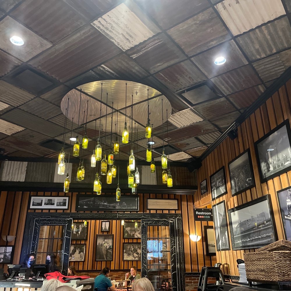 a dining area with a chandelier a dining area with a chandelier