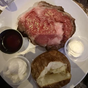 Black Angus Steakhouse - Prime rib with baked potato and au jus - Steakhouses Near Me - Kissimmee, Florida Black Angus Steakhouse - Prime rib with baked potato and au jus - Steakhouses Near Me - Kissimmee, Florida