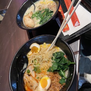 Saku Ramen - Bottom:Tori ramen with pork/yellow noodles/spicy/spinach/egg/corn  Top: tori ramen with chicken/yellow noodles/no spice/spinach/corn - Ramen Near Me - Riverside, California