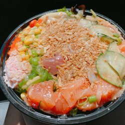 Poke Koma - Regular bowl Base: brown rice and spring mix Protein: 2 scoops salmon 1 scoop tuna Toppings: all but wasabi Sauce: miso garlic