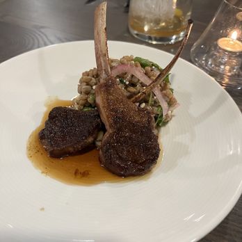 Grezi - Lollipop, lamb chops with farro salad, cider vinaigrette, goat cheese, plum, wine reduction, and cinnamon - New American Near Me - Buffalo, New York Grezi - Lollipop, lamb chops with farro salad, cider vinaigrette, goat cheese, plum, wine reduction, and cinnamon - New American Near Me - Buffalo, New York