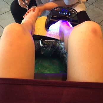 Elegant Nails - Curing light hovering over the filled foot tub. - Nail Salons Near Me - Delta, British Columbia Elegant Nails - Curing light hovering over the filled foot tub. - Nail Salons Near Me - Delta, British Columbia