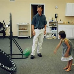 Orthopedic& Spine Physical Therapy - PTA Paul Toran working with a patient in our gym