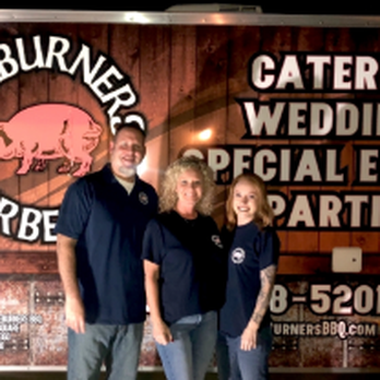 Side Burners BBQ - two people standing in front of a bbq trailer - Barbeque Near Me - Tate, Georgia