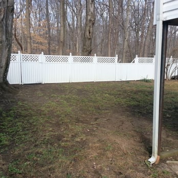 Alston Landscaping, LLC - a back yard with a white fence - Landscaping Near Me Alston Landscaping, LLC - a back yard with a white fence - Landscaping Near Me
