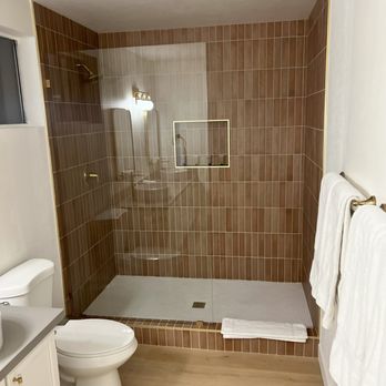 SCT Flooring - terracotta tile for this awesome shower in this scottsdale air bnb - Flooring Near Me
